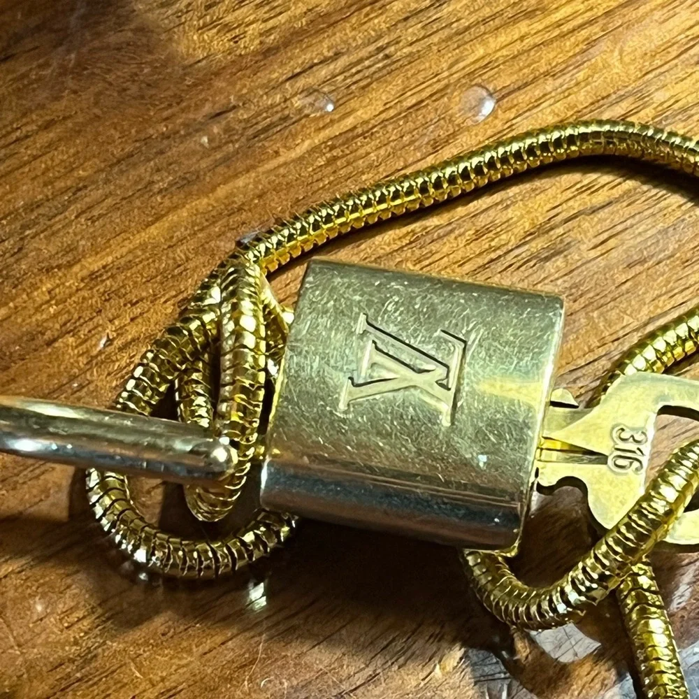 Louis Vuitton Gold Lock On off brand chain No 316 Works. Authentic